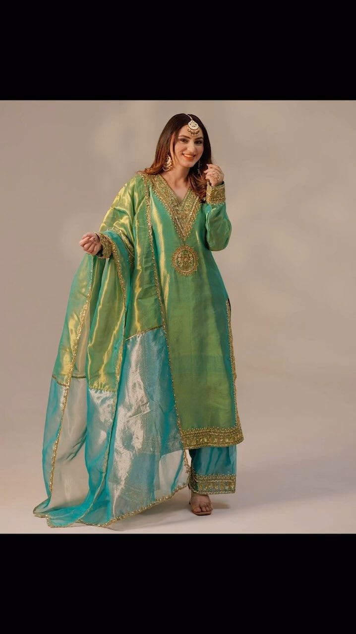Silk Shimmer Turquoise and Green with Golden detailing, giving it a rich and luxurious appeal.with a Jimmy Choo-inspired finish features intricate sequins and thread embroidery.