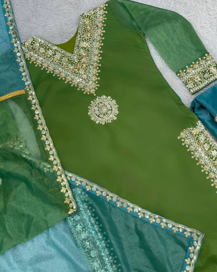 Silk Shimmer Turquoise and Green with Golden detailing, giving it a rich and luxurious appeal.with a Jimmy Choo-inspired finish features intricate sequins and thread embroidery.