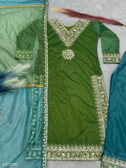 Silk Shimmer Turquoise and Green with Golden detailing, giving it a rich and luxurious appeal.with a Jimmy Choo-inspired finish features intricate sequins and thread embroidery.